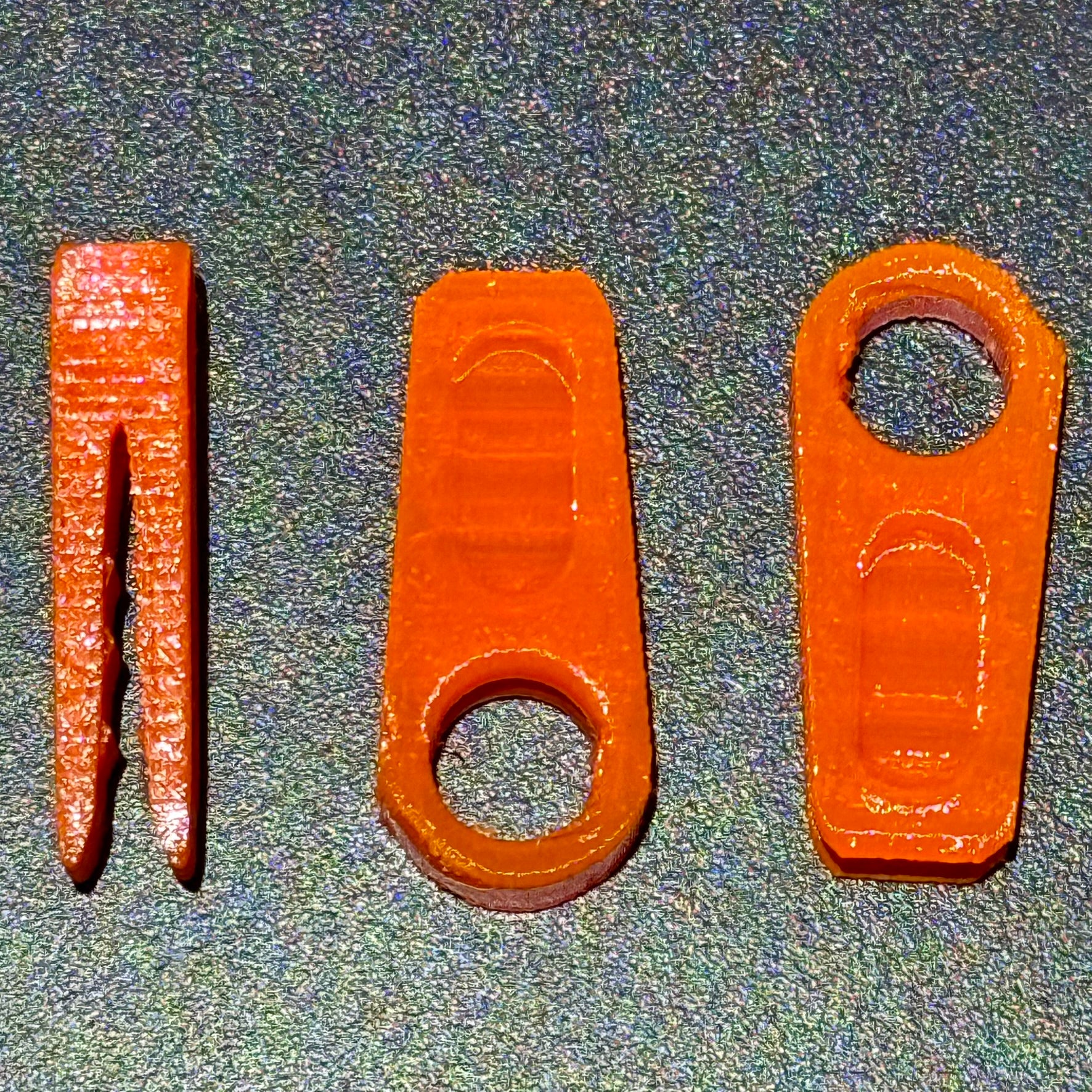 Atomic orange rim clips on matte black background