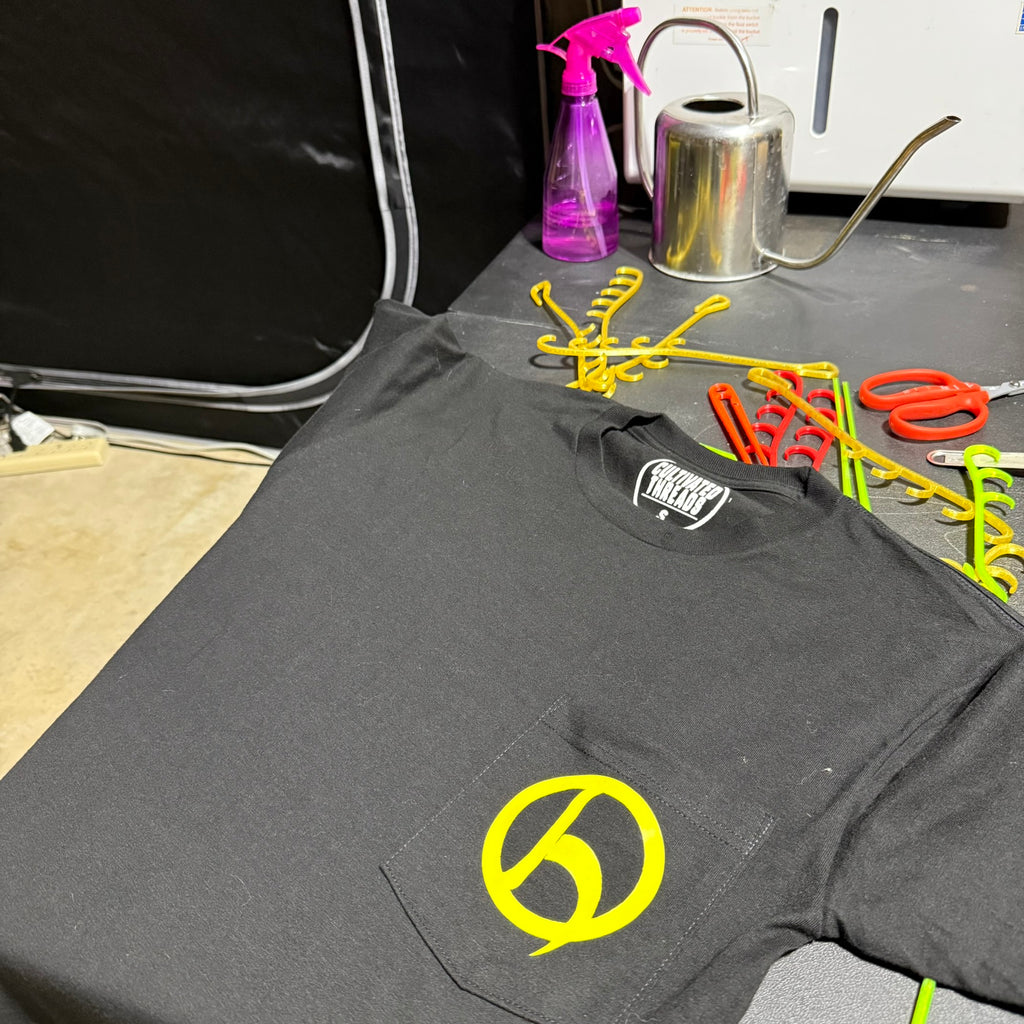 HempHooks logo pocket tee in grow room